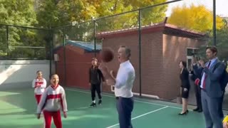 Gavin Newsom runs over a small Chinese child while playing basketball during his visit to China