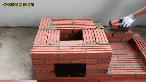 Outdoor wood stove from red brick and cement