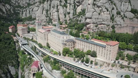 drone view of saw mountain montserrat with santa maria de montserrat monastery