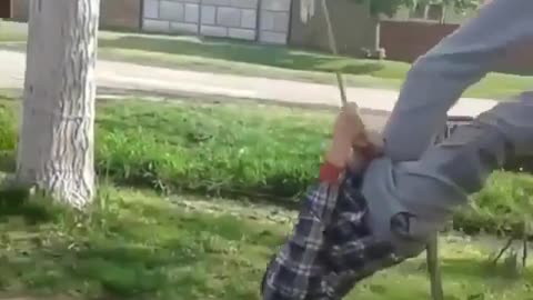 Funny man falls on the swing