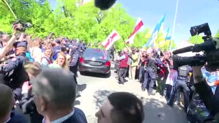Russian ambassador doused in red by protesters in Poland