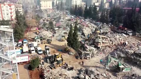 Syrians seek news at graveyard of unknown quake victims