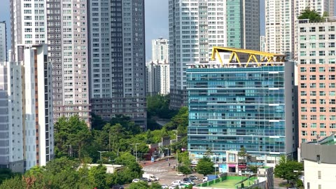 a residential complex with clear skies and high-rise apartments