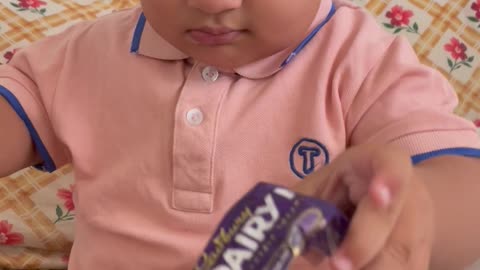 Baby eating chocolate