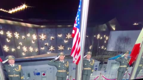 Strange Sight: A Chinese Soldier Dramatically Presents the US Flag At Medal Ceremony