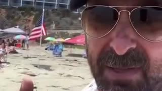 Lefty triggered by American flags at the beach
