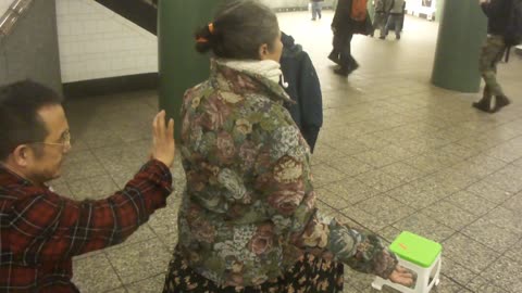 Luodong Massages Older Woman In Subway Station