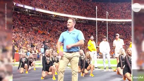 Busted! Fake security guard dances during Tennessee football game | USA TODAY