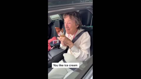 Elderly woman super excited for surprise ice cream cone