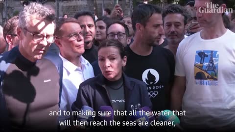 Paris mayor swims in the Seine to show it's clean enough for Olympic swimming events