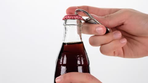Opening a bottle of cola