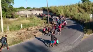 Drone footage shows migrants trekking through Mexico