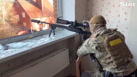 Ukrainian snipers fire at Russian soldiers on urban battlefield in Bakhmut