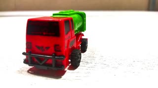 green truck with the red head cabin