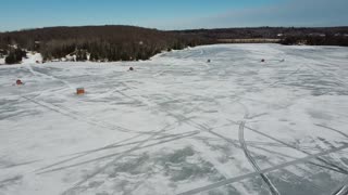 Lake Nosbonsing Ontario Canada - Ice fishing / frozen lake drone view Feb 2024