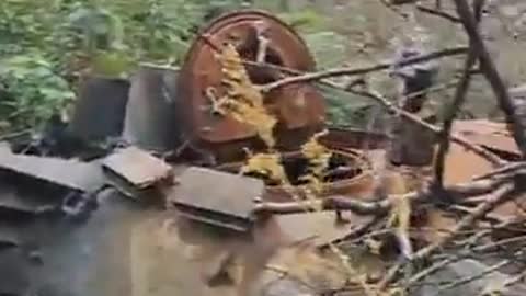 A destroyed russian tank up-close with its turret blown off