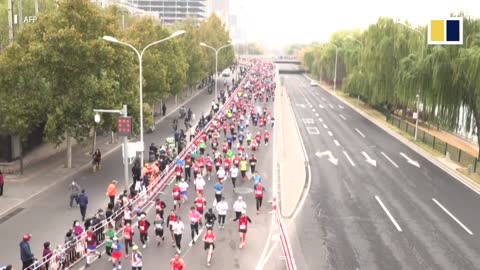 Runners thrilled to compete as Beijing marathon returns after two-year Covid hiatus