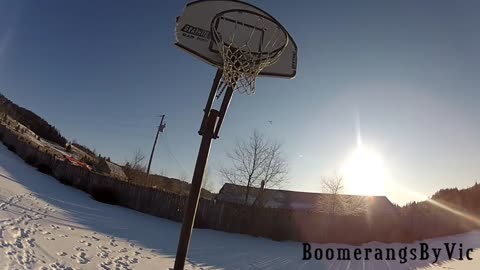 Amazing boomerang trick shot into basketball hoop