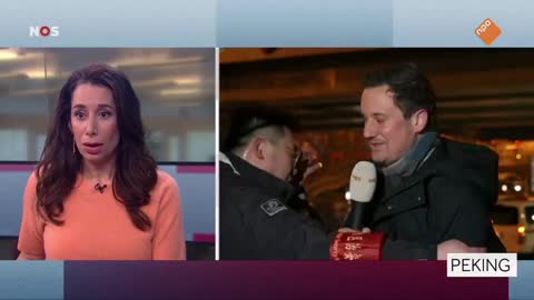 Dutch reporter, who is in Beijing to cover the games, pulled away by CCP agents while on air