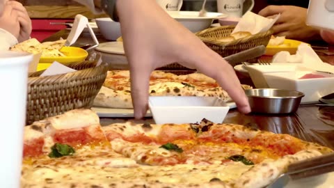 the hands of people eating in restaurants