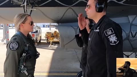 Beautiful female pilot of USAF flying F-16 fighter jet Demo flight over Huston