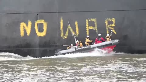 'No coal no war': Greenpeace chases Russian ship