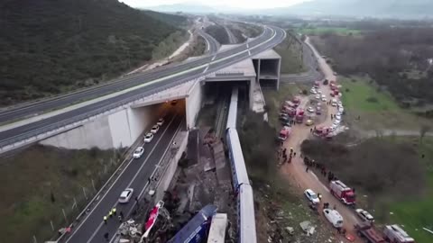 HCNN - GREECE - Rescuers delve through wreckage after fiery train collision in Greece