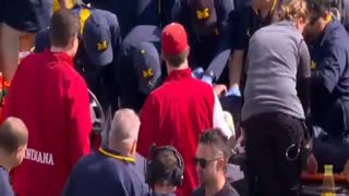 Michigan coach collapses on sideline during game!