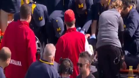 Michigan coach collapses on sideline during game!