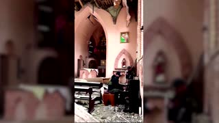 Volunteer plays piano inside destroyed Ukrainian church
