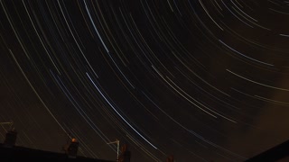 Star trail time laps over the roof tops.