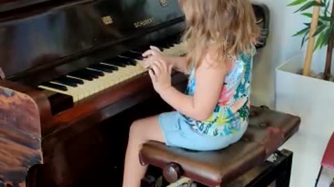 Little girl playing piano