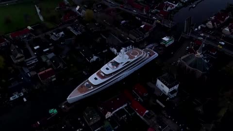 Drone captures superyacht docked on tiny Dutch canal