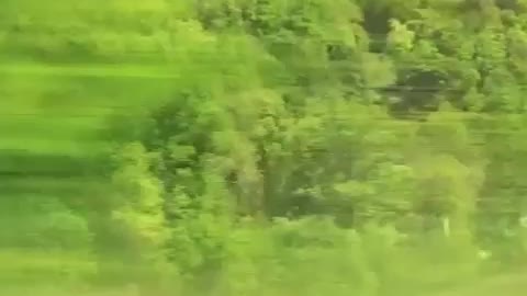 Looking out the window of a passenger train