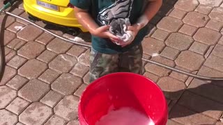 Cute Kid Washes Toy Car