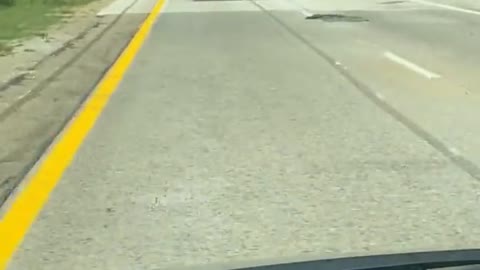 Over-Sized Load Sends Construction Cones Flying