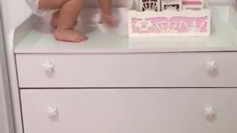 Girl Finds A Way To Climb Onto Dresser