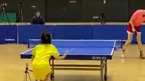 Another good point a girl and man table tennis match
