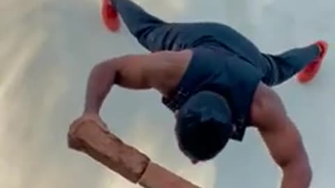 Man_Does_Push-Ups_Against_the_Wall_While_Balancing_on_Three_Slanting_Bricks_- BEAUIFUL AMAZING STEP