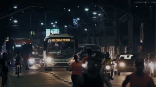 Athletics Running Among Traffic Road Full Of Busses And Cars