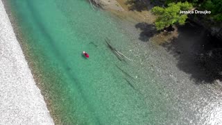 Kayaking Canadian scientist monitors river health