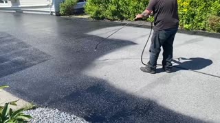 Professional Asphalt Spray Sealing: “The Hedgy Edgy One” Top Coats Pavement Maintenance