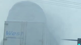 Snow Covered Truck Takes out Traffic Light