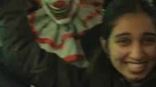 Person subway train packed scary clown costume