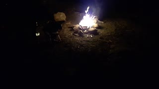 Campfire. Sounds of the fire and a river.
