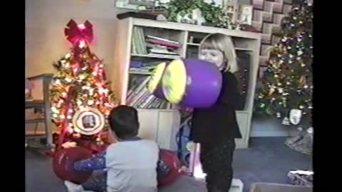 Boy Tricks Sister And Knocks Her Down With Inflatable Boxing Gloves