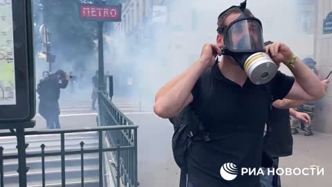 Tear gas fired at the protests in Paris against Covid restrictions