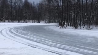 Group of Cars Slide Around Icy Corner