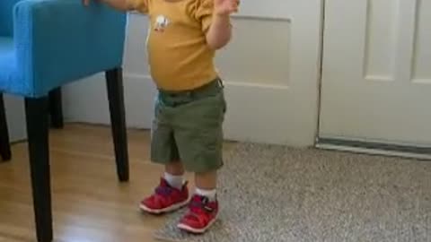 Child with down syndrome walking to mum off the chair