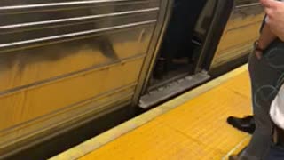 Womans hair stuck on closing doors of subway